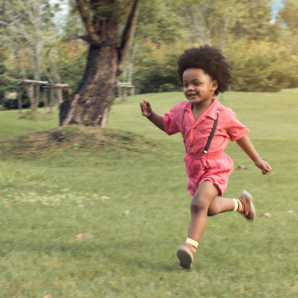 Toddler boy running in the park