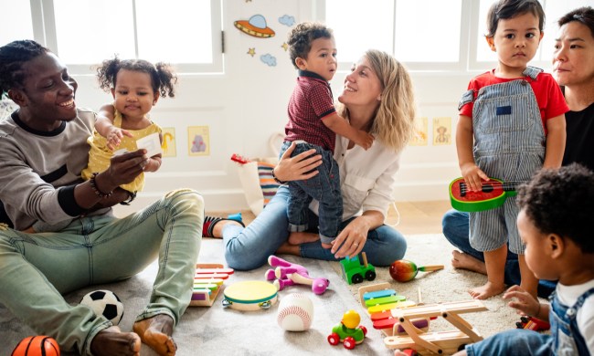 Toddlers having fun in a playgroup with parents