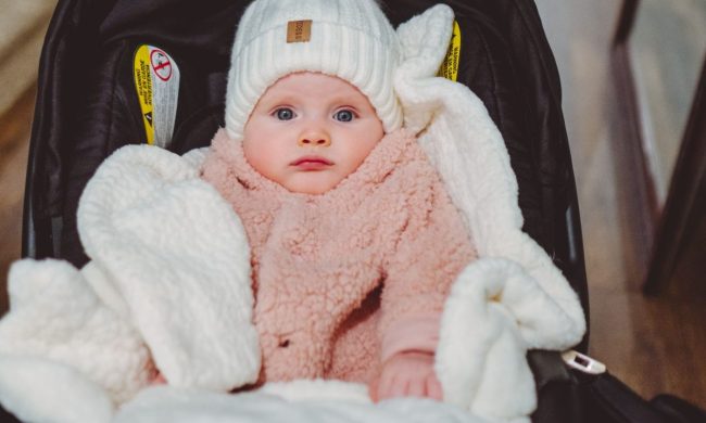 Baby in a seat bundled up for winter cold