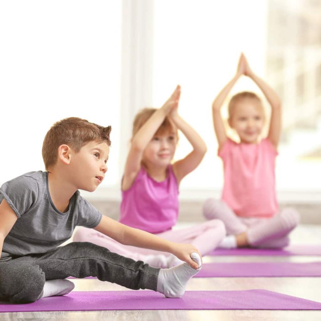 Kids doing yoga.