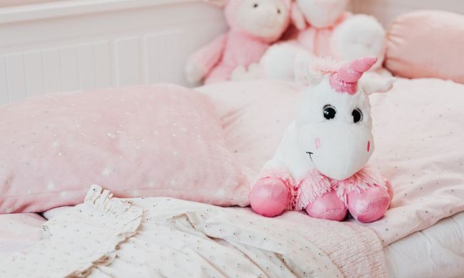 Plush unicorn on a child's bed