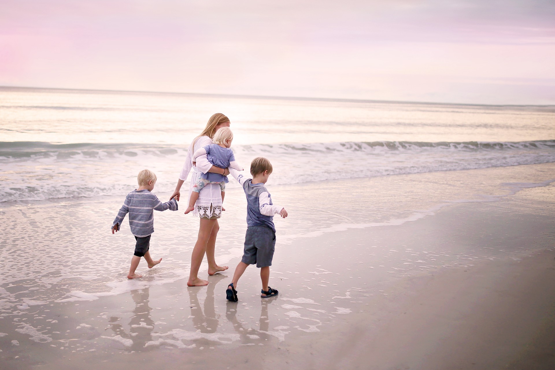 Family walks on a beach