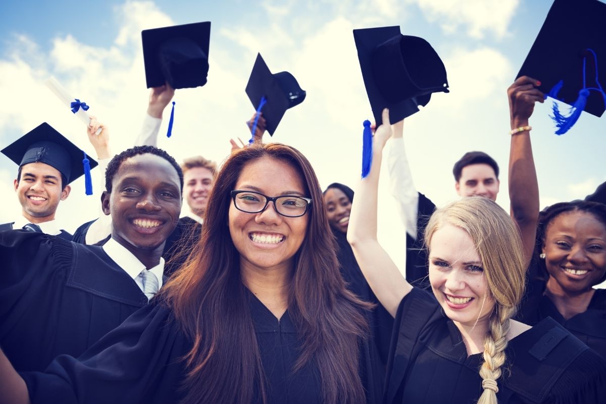 Teens at graduation in their caps and gowns
