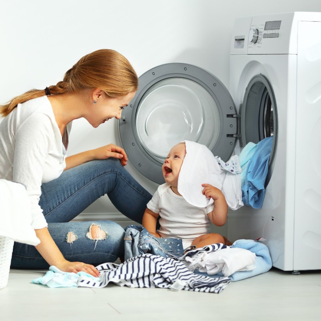 mom and baby doing laundry