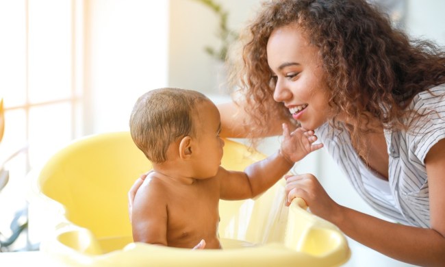 Mom giving her baby a bath