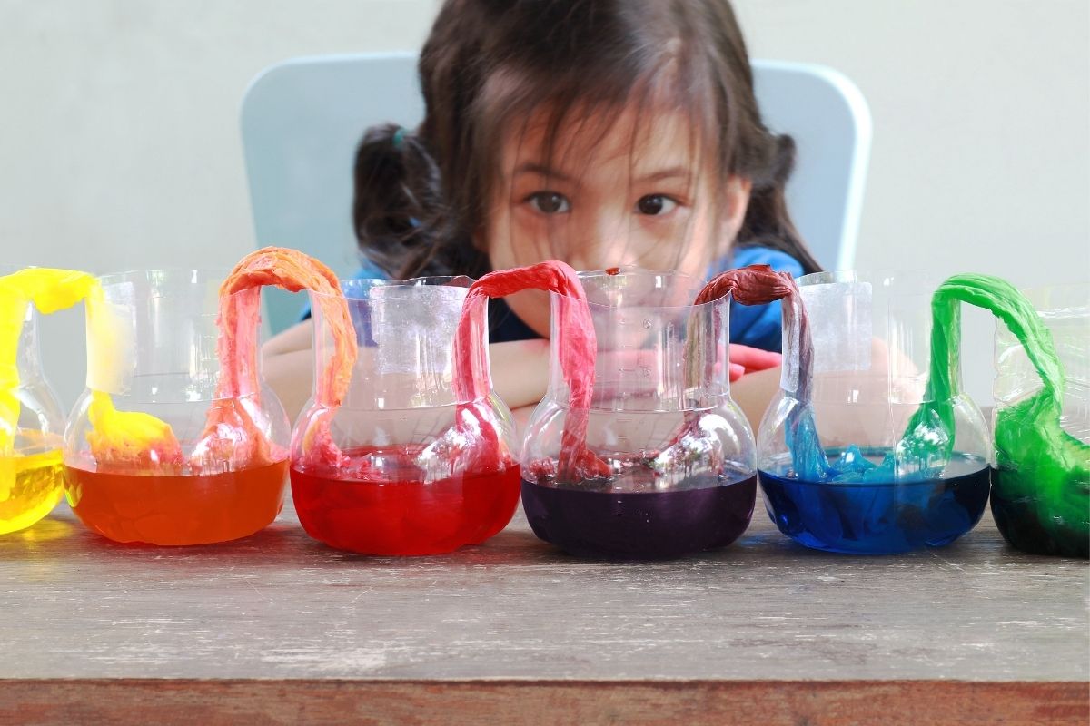 Girl conducting a kids' science experiment at home.