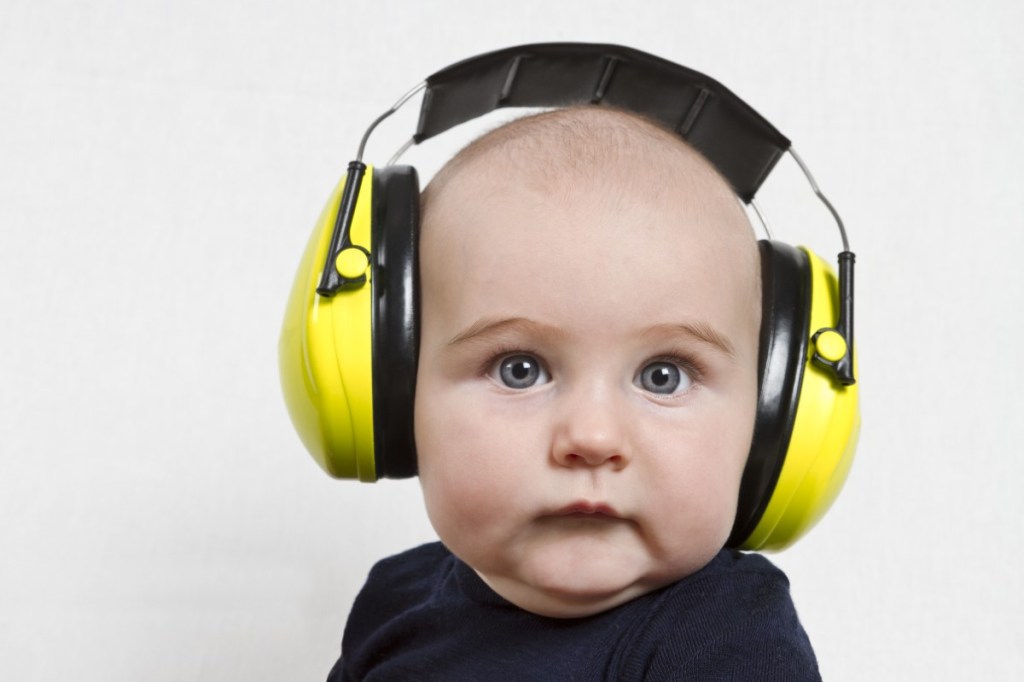 Baby with noise-canceling headphones