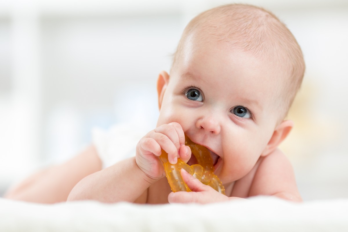 Baby with teething toy