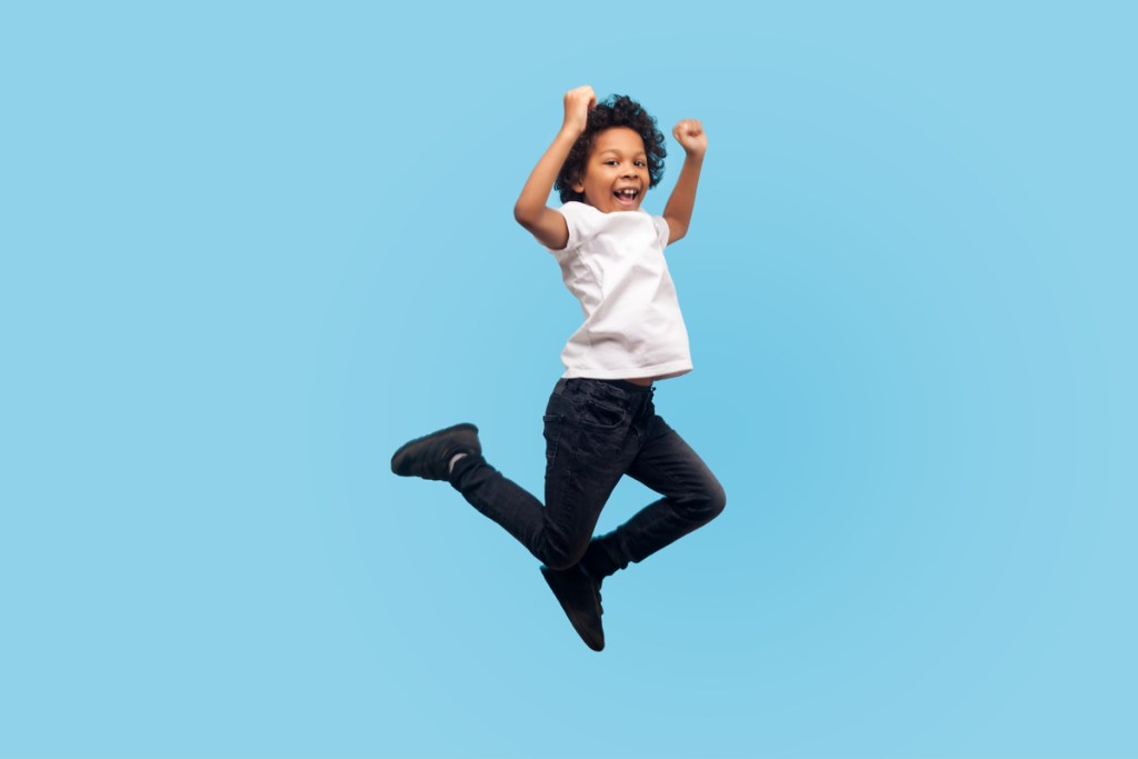 boy having fun jumping on a trampoline