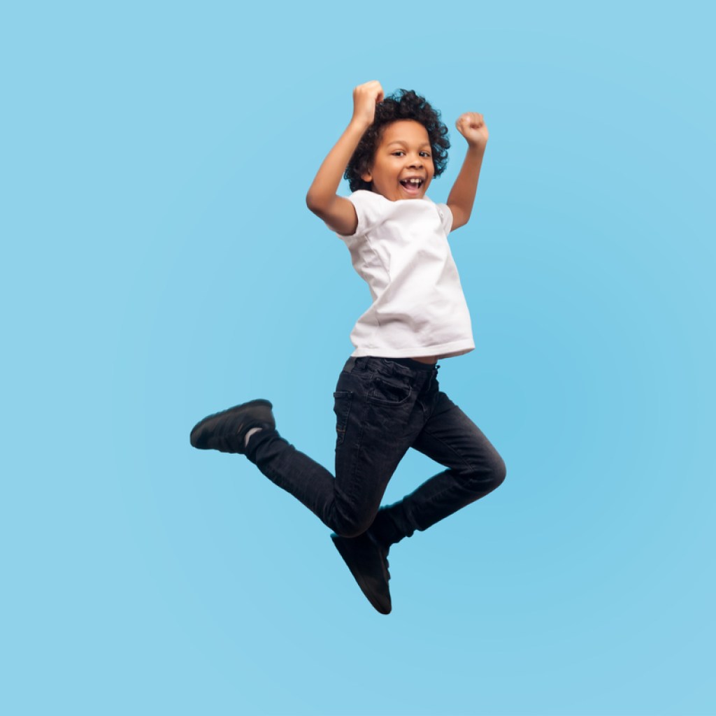 boy having fun jumping on a trampoline