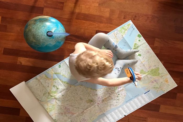 Boy exploring a map