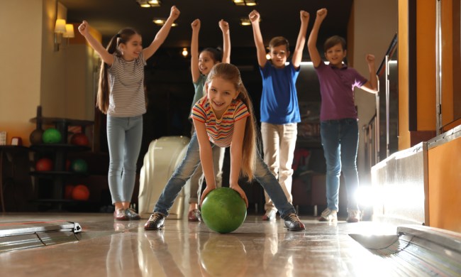 Kids having fun at a bowling alley party
