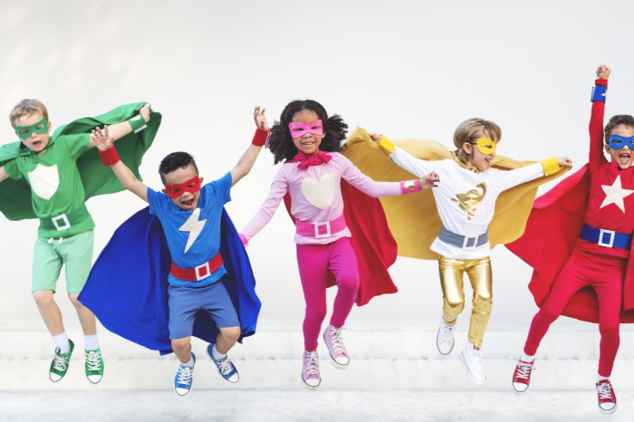 A group of kids dressed in superhero costumes