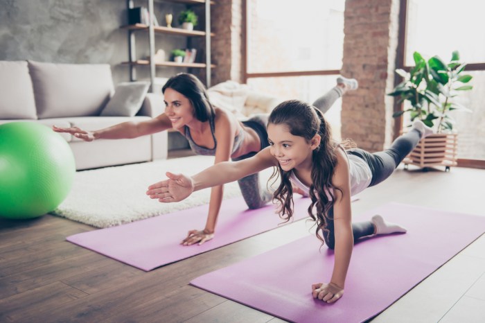 Mom and daughter doing a yoga workout