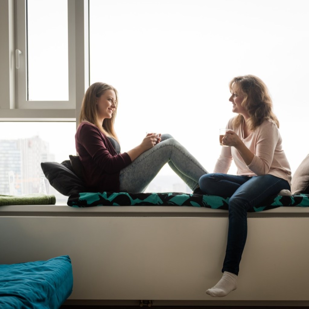 A parent and teen talking.