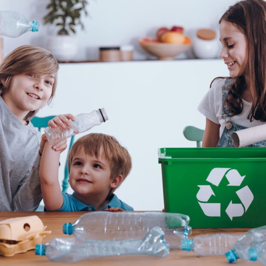siblings sorting recyclable material