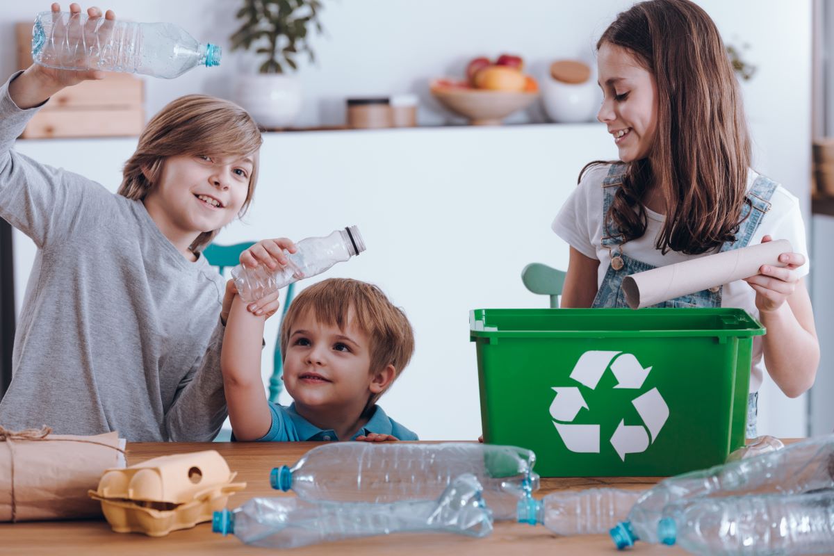 siblings sorting recyclable material