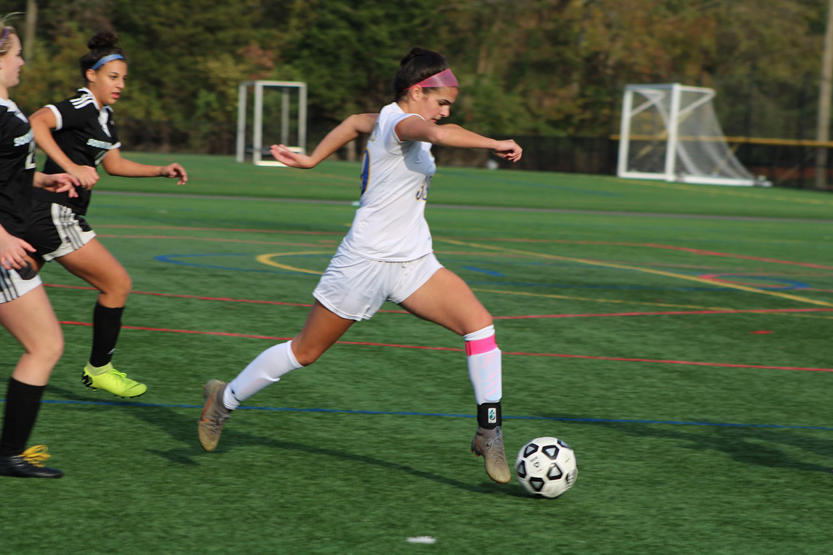 Amanda Mendez looks to score in a high school soccer game