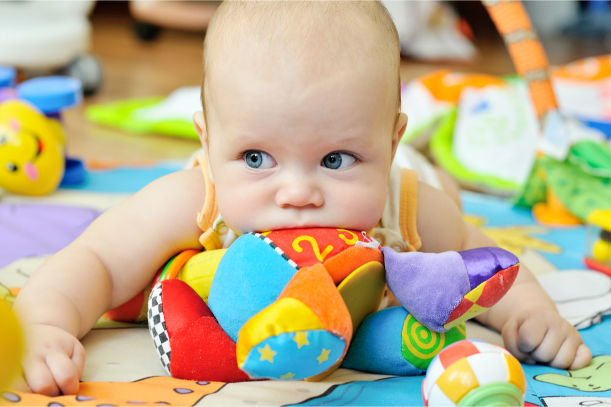Baby having fun playing with developmental toys