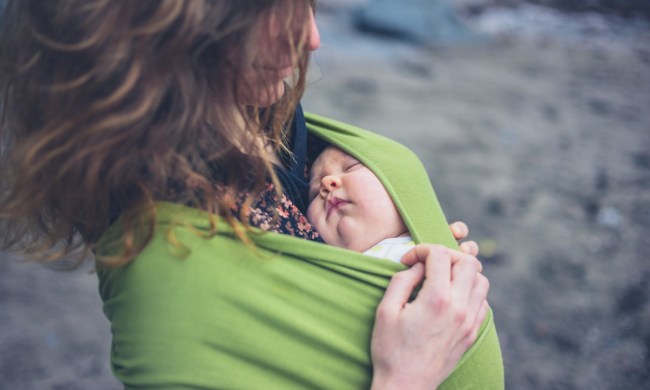 Mom with child in a baby sling.