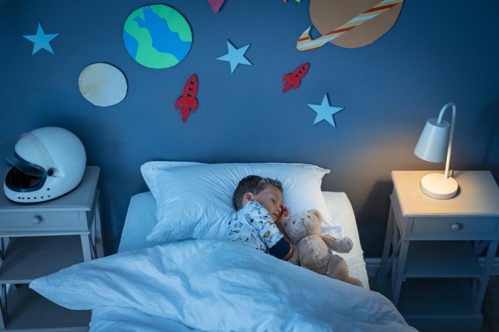 A boy sleeping in his bedroom