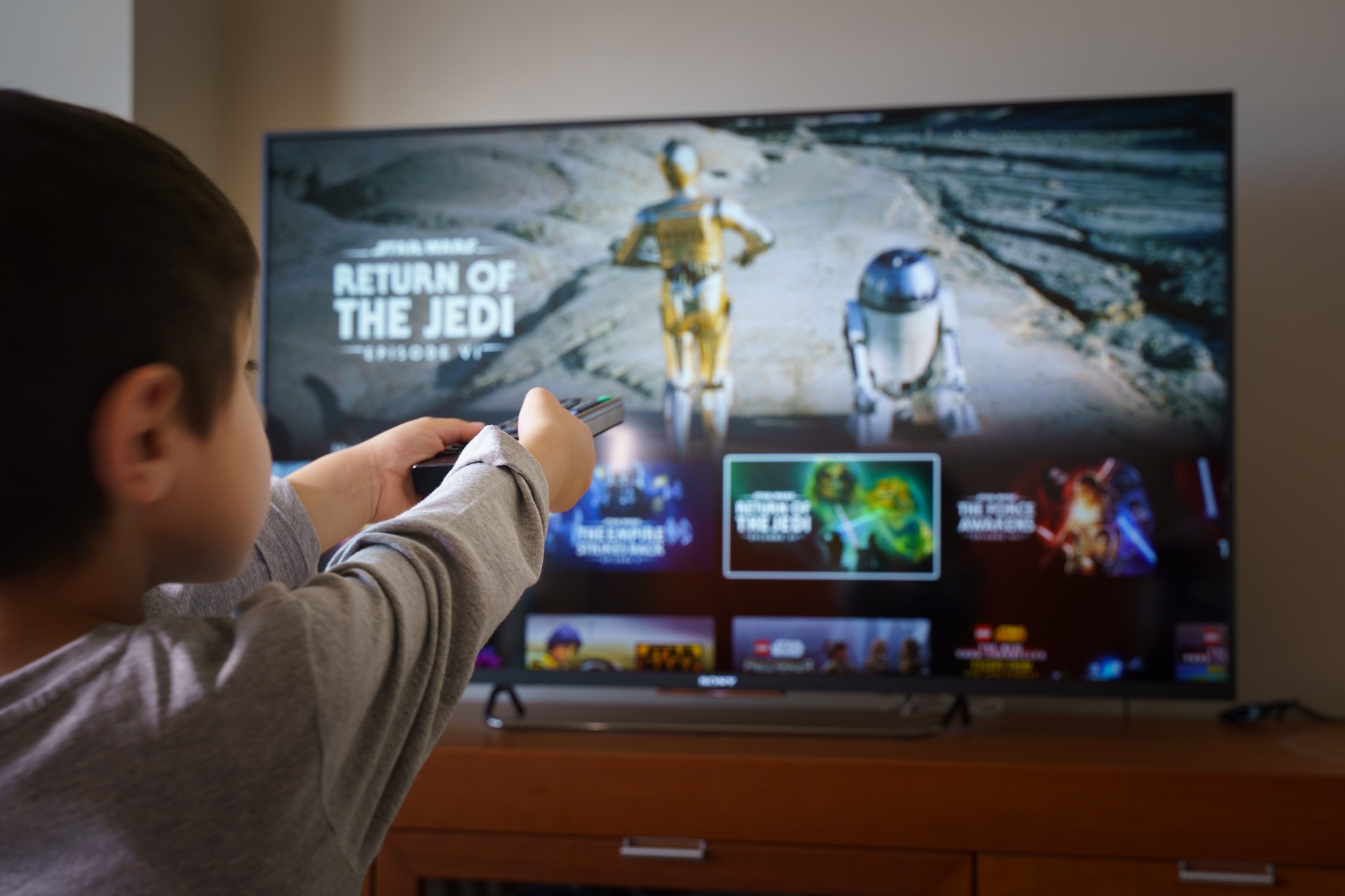 Boy watching Star Wars on Disney+