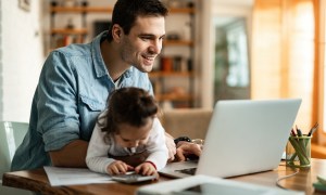 Dad working from home with toddler