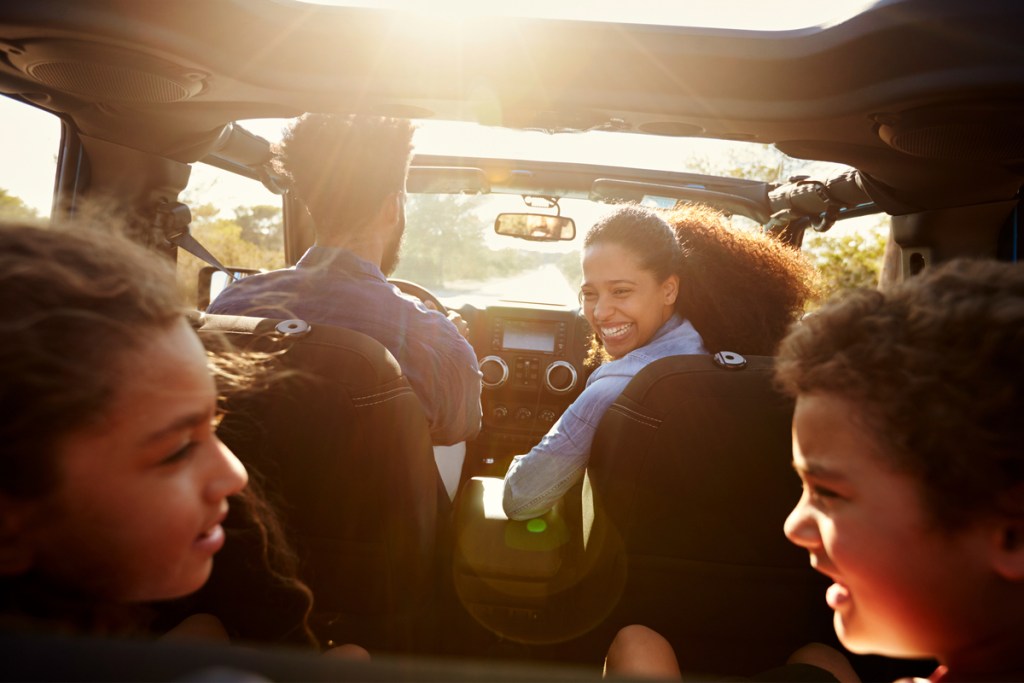 Family enjoying a podcast during a road trip