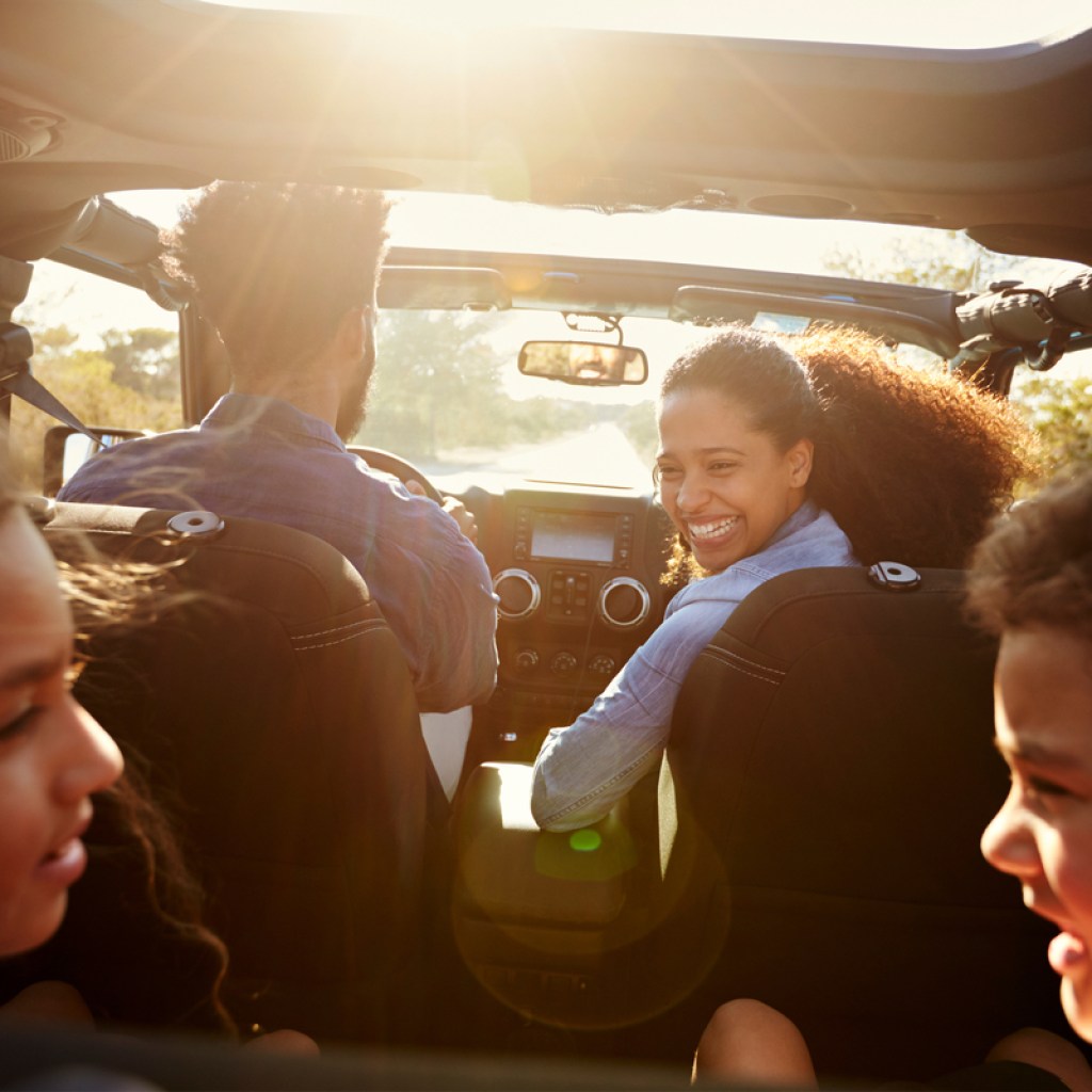 Family enjoying a podcast during a road trip