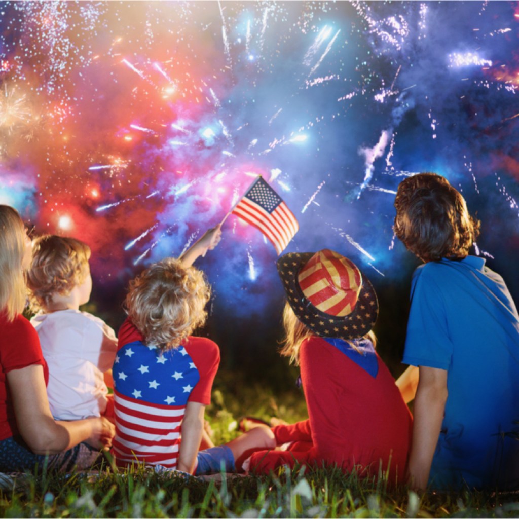 Family enjoying fireworks at night
