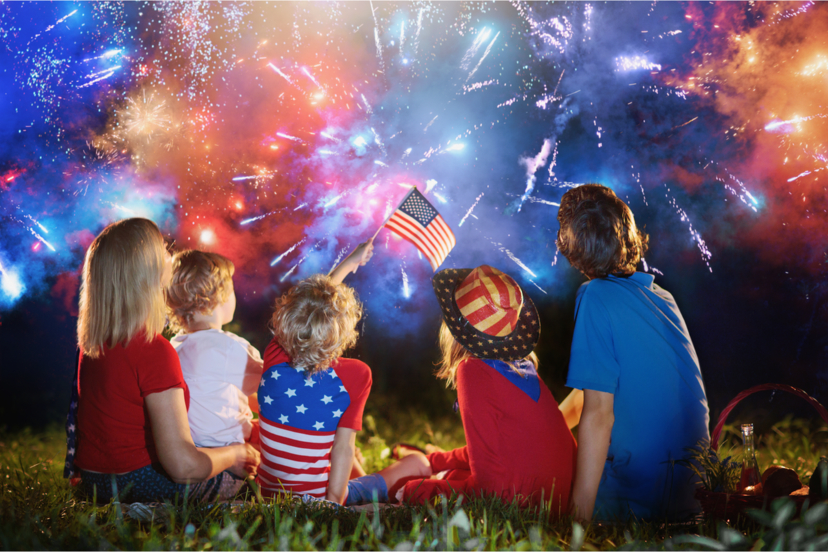 Family enjoying fireworks at night