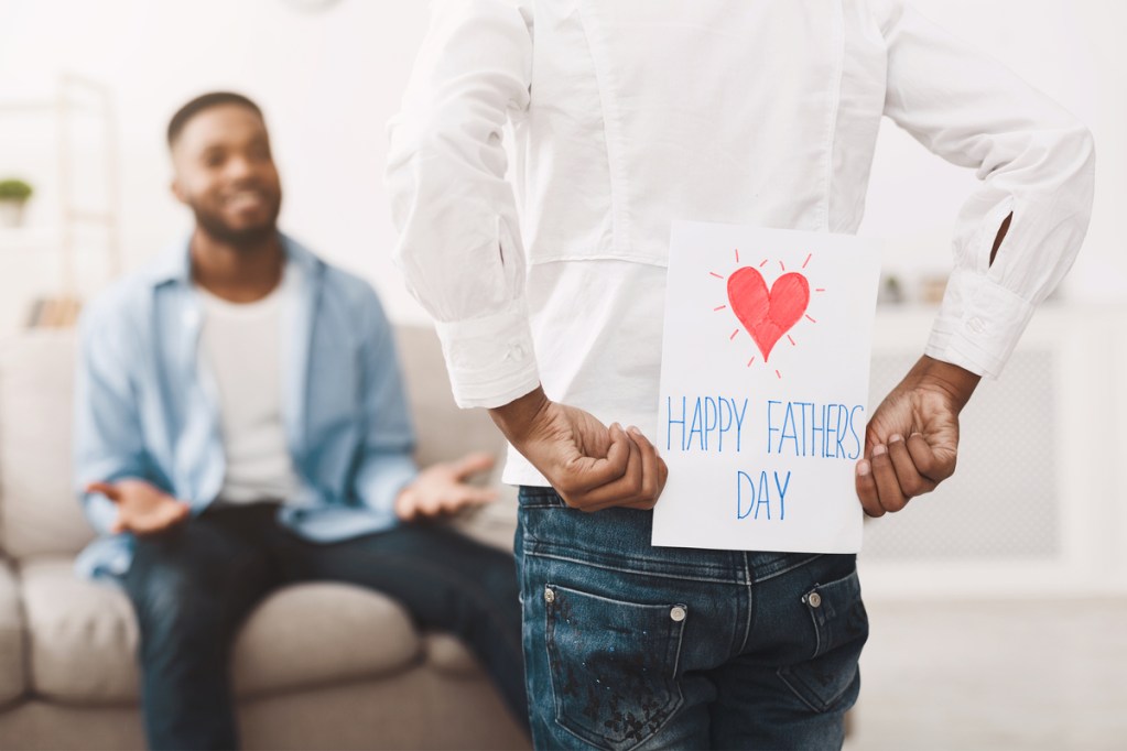Teen hiding card for their dad on Father's Day