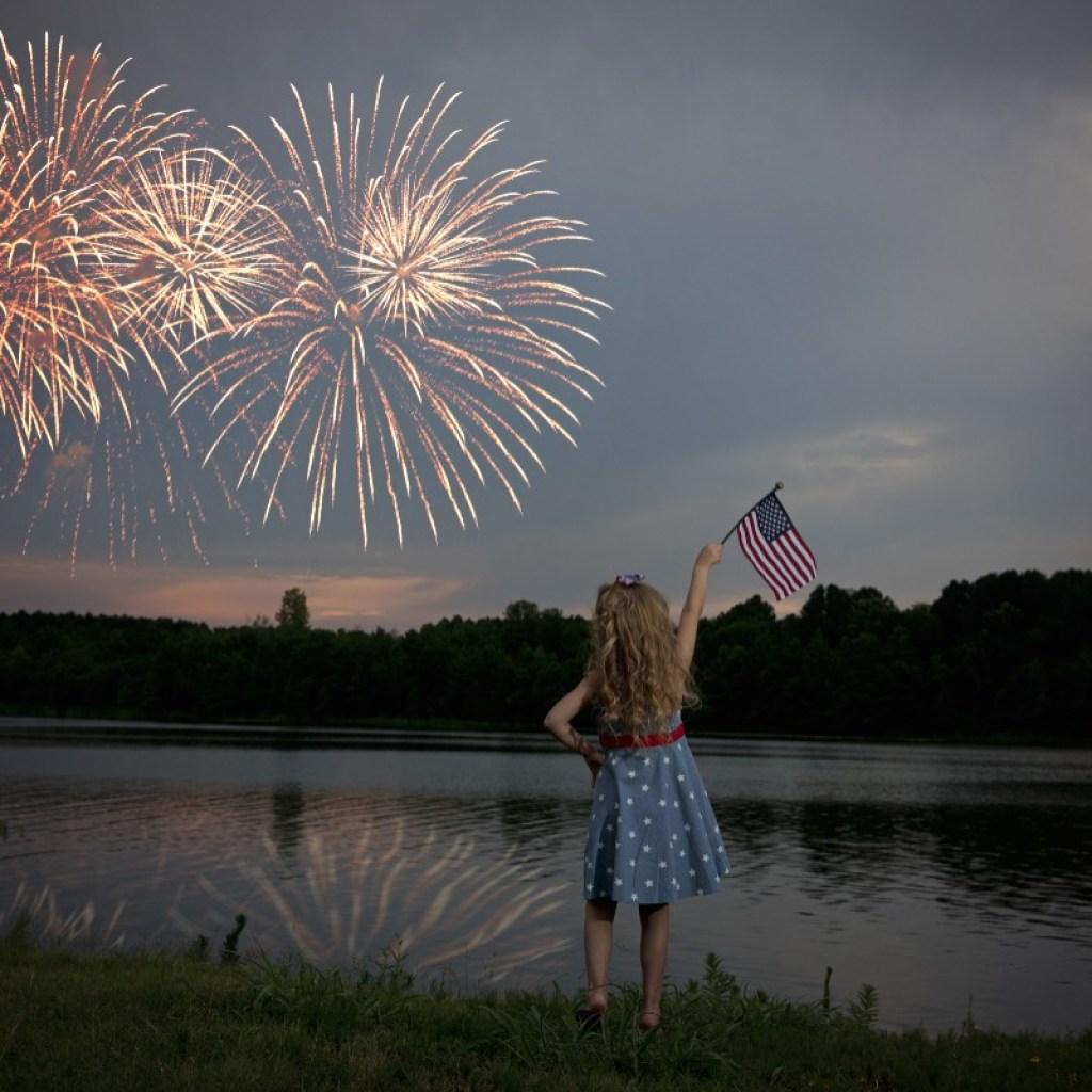 Fourth of July fireworks watched by a girl