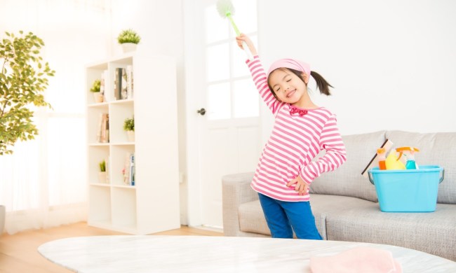 Little girl cleaning her home