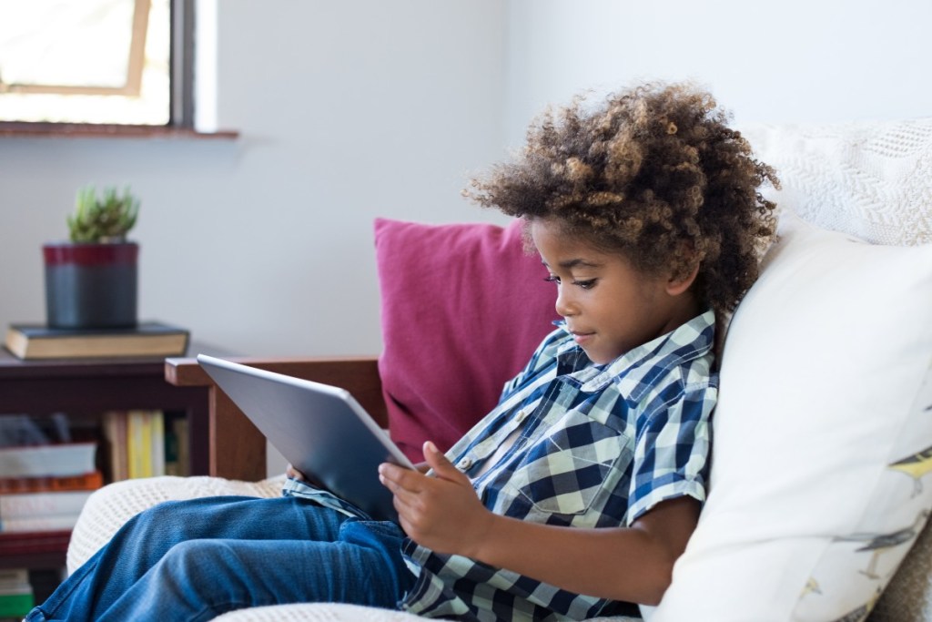 Young boy on an iPad.