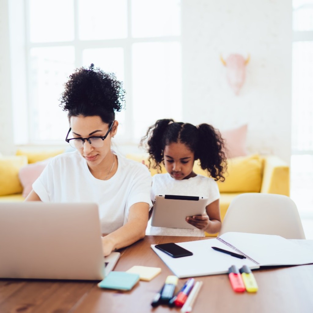 Mom working from home with daughter
