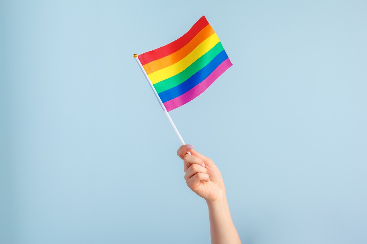 Person waving a Pride flag