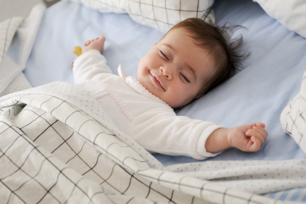 Smiling baby sleeping