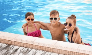 Tweens having fun in a pool