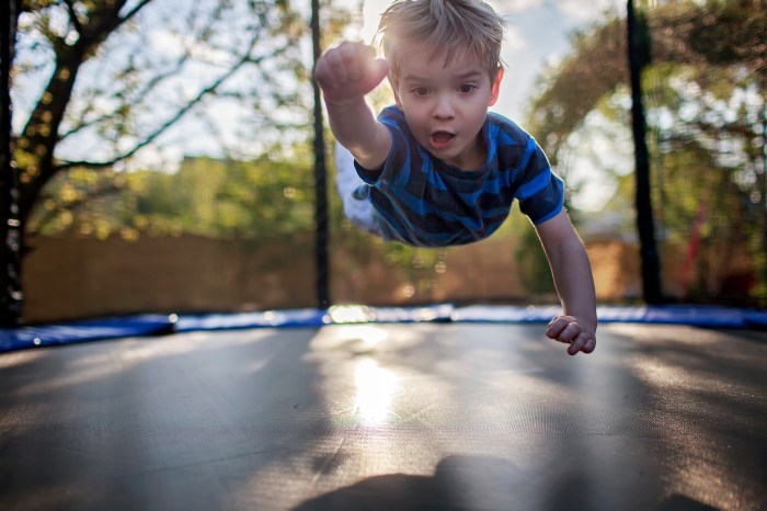 Boy playing on a trampoline