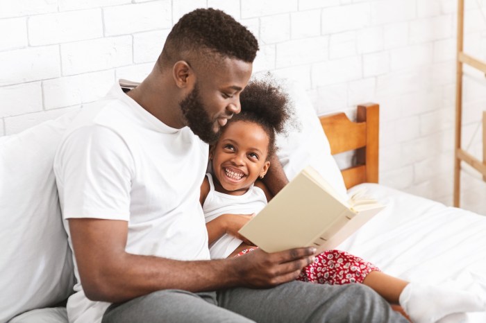 Dad reading to his daughter