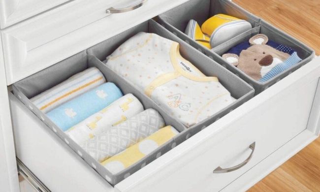 Drawer full of baby clothes