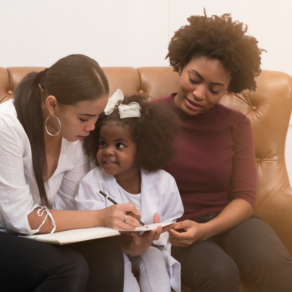 Family reading together on couch