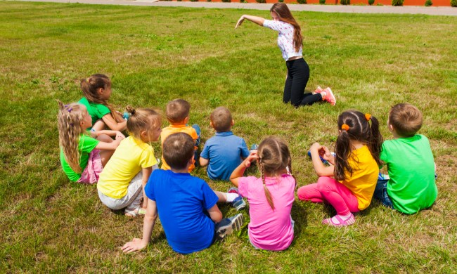 Group of kids playing improv game outside