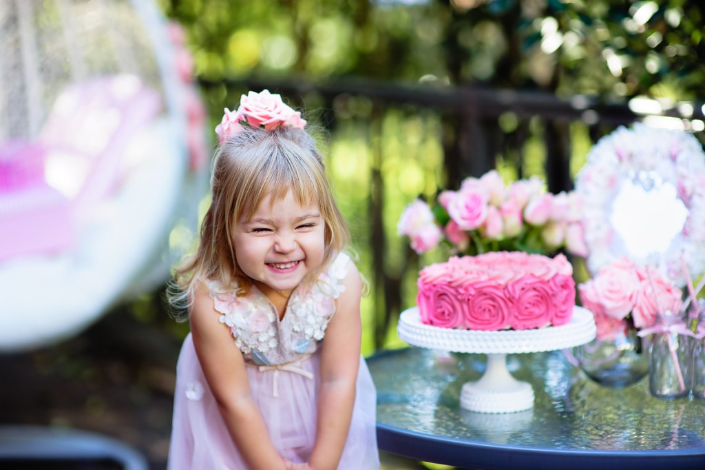 Toddler girl celebrating summer backyard birthday