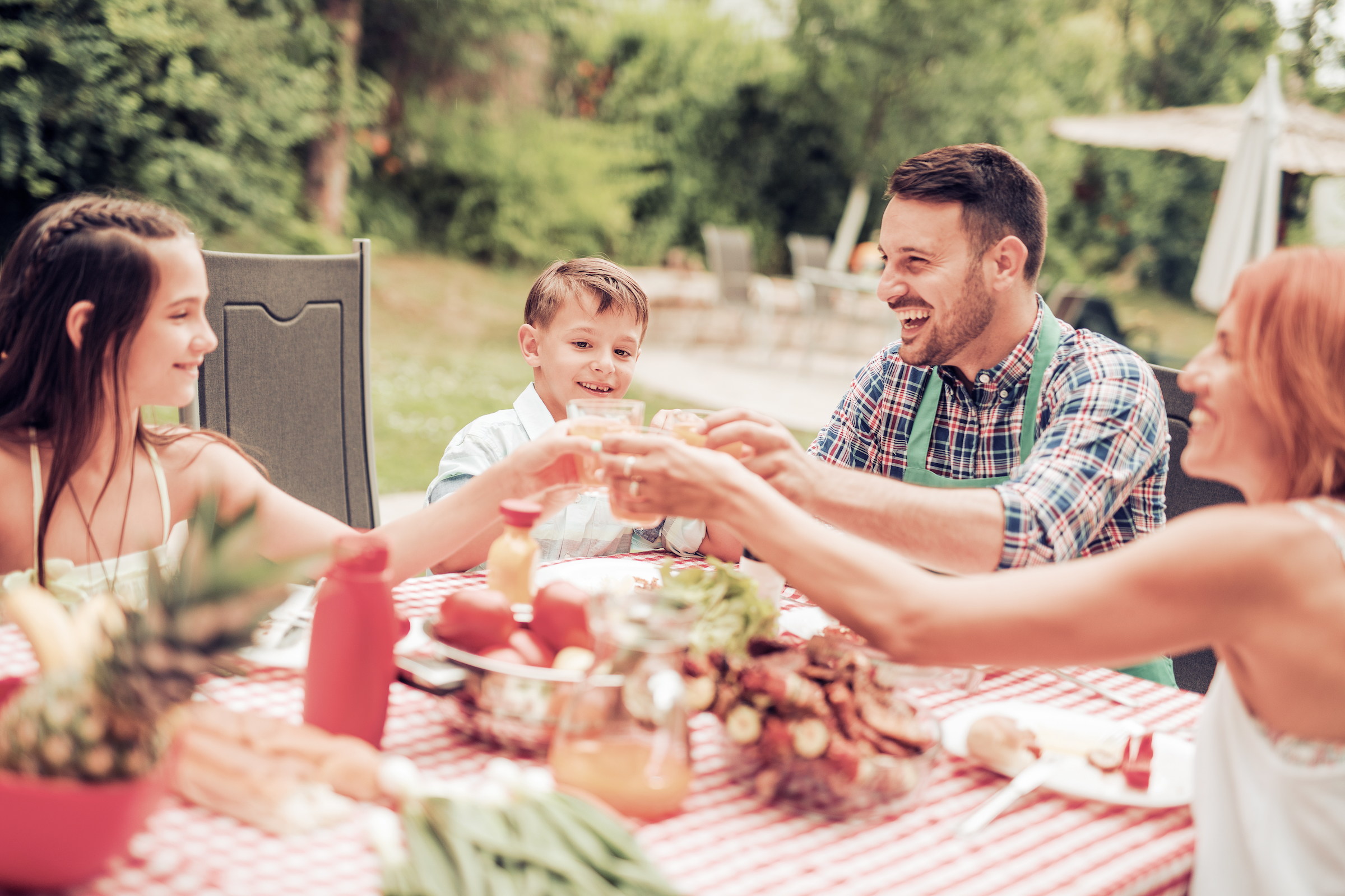 Family eating dinner outdoors