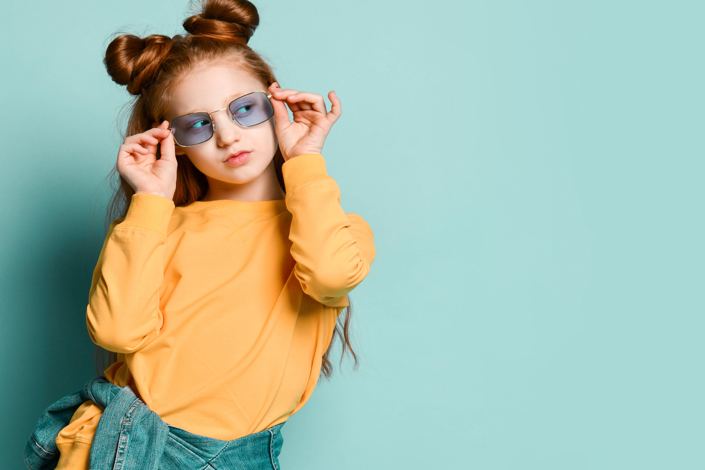 preteen girl modeling glasses
