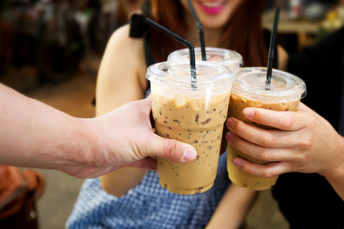 People drinking iced coffees.