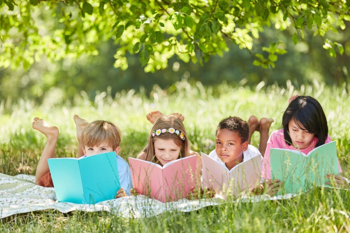 Kids reading outside on a summer day