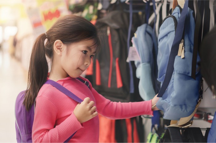 kindergarten girl shopping for a backpack for school